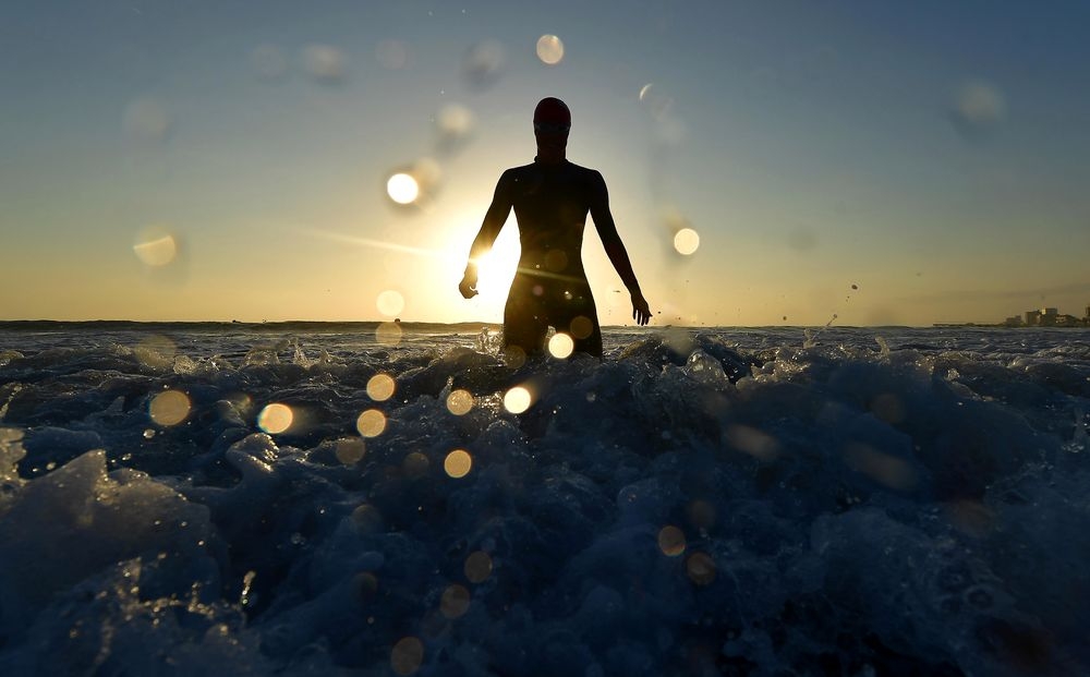 MORNING GLORY: A female athlete enters the Indian Ocean in advance of Saturday's 2018 Isuzu IRONMAN 70.3 World Championship. In total, nearly 4,500 athletes are registered to partake in the first IRONMAN 70.3 World Championship to hit the African continen MORNING GLORY: A female athlete enters the Indian Ocean in advance of Saturday's 2018 Isuzu IRONMAN 70.3 World Championship. In total, nearly 4,500 athletes are registered to partake in the first IRONMAN 70.3 World Championship to hit the African continen