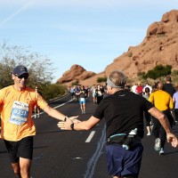 HELPING HAND: Two runners support one another as they continue on their journey during the 2019 Humana Rock &#039;n&#039; Roll Arizona Marathon &amp; ½ Marathon event (Photo: Ezra Shaw/Getty Images for Rock ‘n’ Roll Marathon Series)