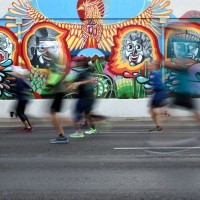 UNDER THE EYE OF THE PHOENIX: Runners stream past some colorful street art that lines the course of the 2019 Humana Rock &#039;n&#039; Roll Arizona Marathon &amp; ½ Marathon course (Photo: Ezra Shaw/Getty Images for Rock ‘n’ Roll Marathon Series)